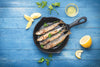 garfish on a pan being prepared