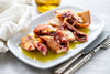 Octopus in Olive oil being served